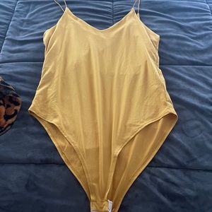 Body suit snaps at bottom